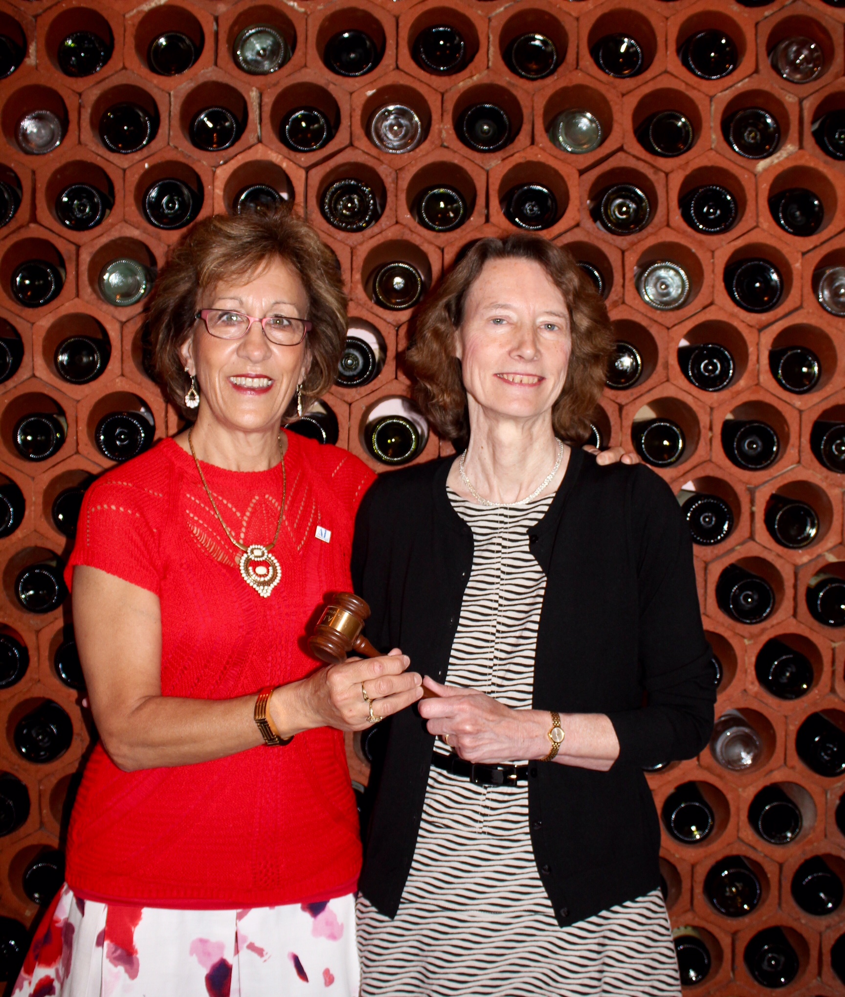 Outgoing President Pat Thompson (right) handing over the gavel to President Linda Shilts